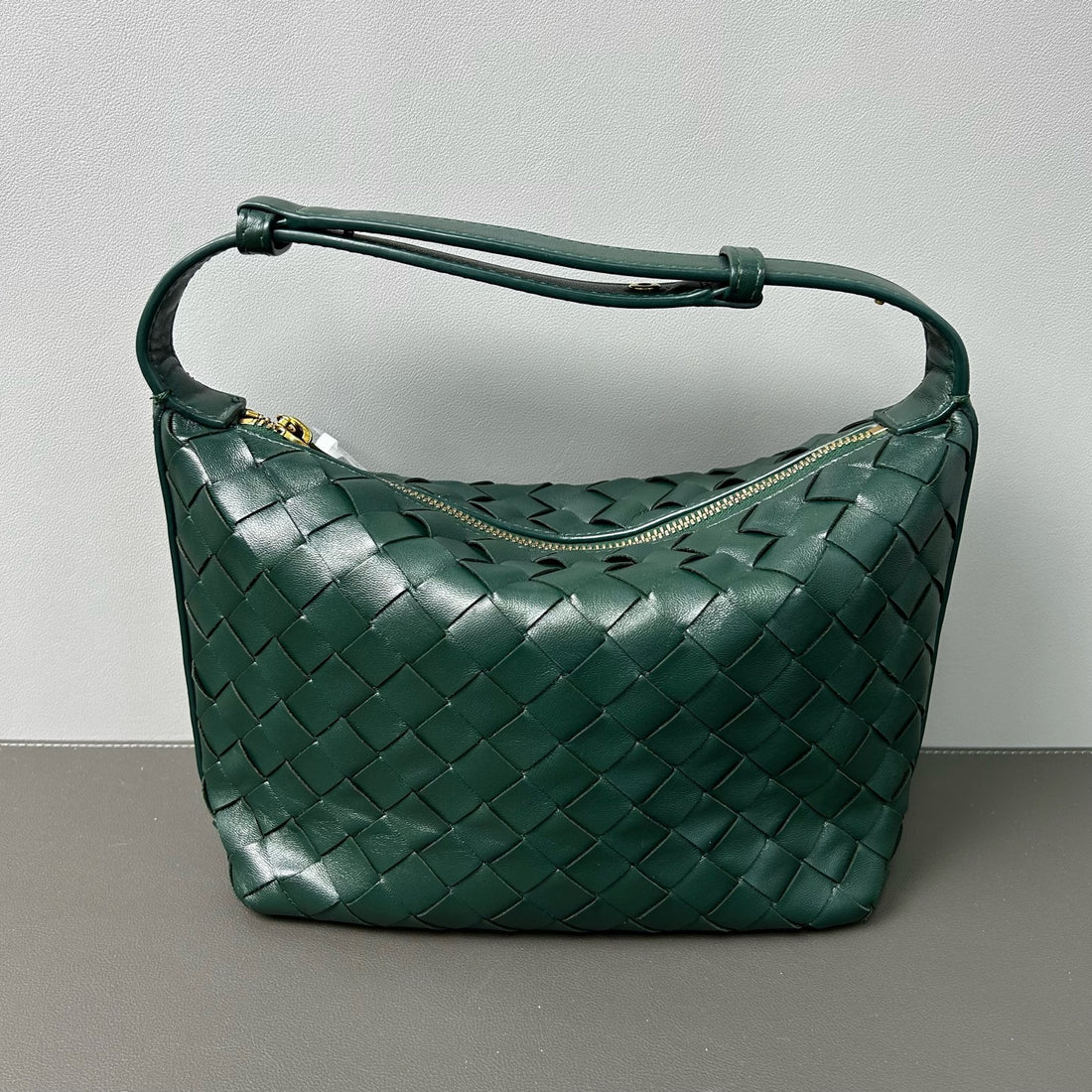 Bottega Veneta's classic Intrecciato weaving technique. Made of calfskin.