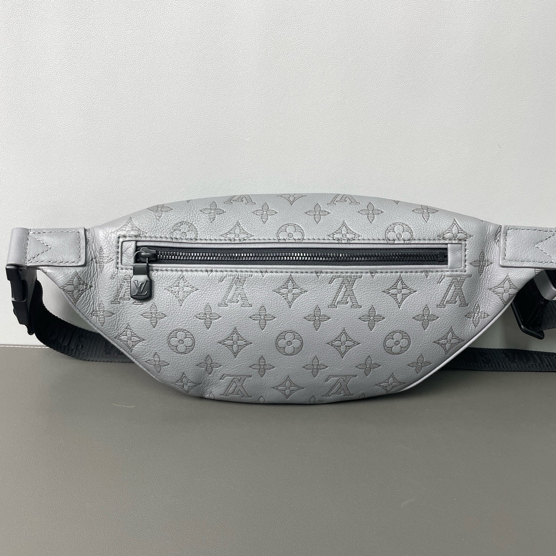 Louis Vuitton grey embossed chest bag
