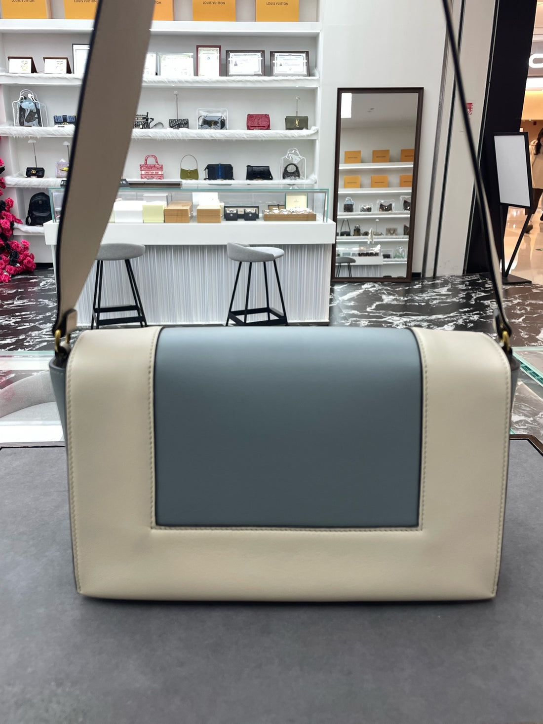 Celine Frame Bag, a flap-top tofu bag with a striking blue-grey color-block design.