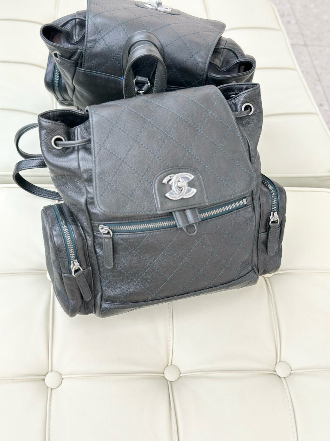 CHANEL Leather Backpack with Silver Buckle