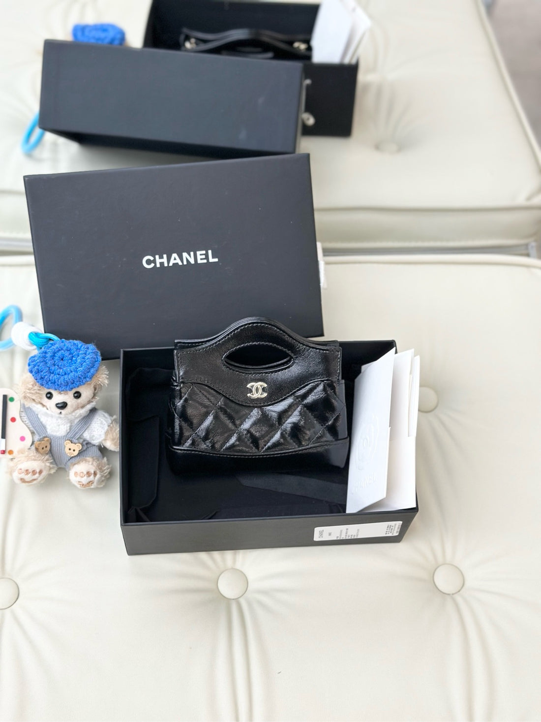 Chanel 24S series 31 bag mini, black vintage lambskin with light gold hardware.