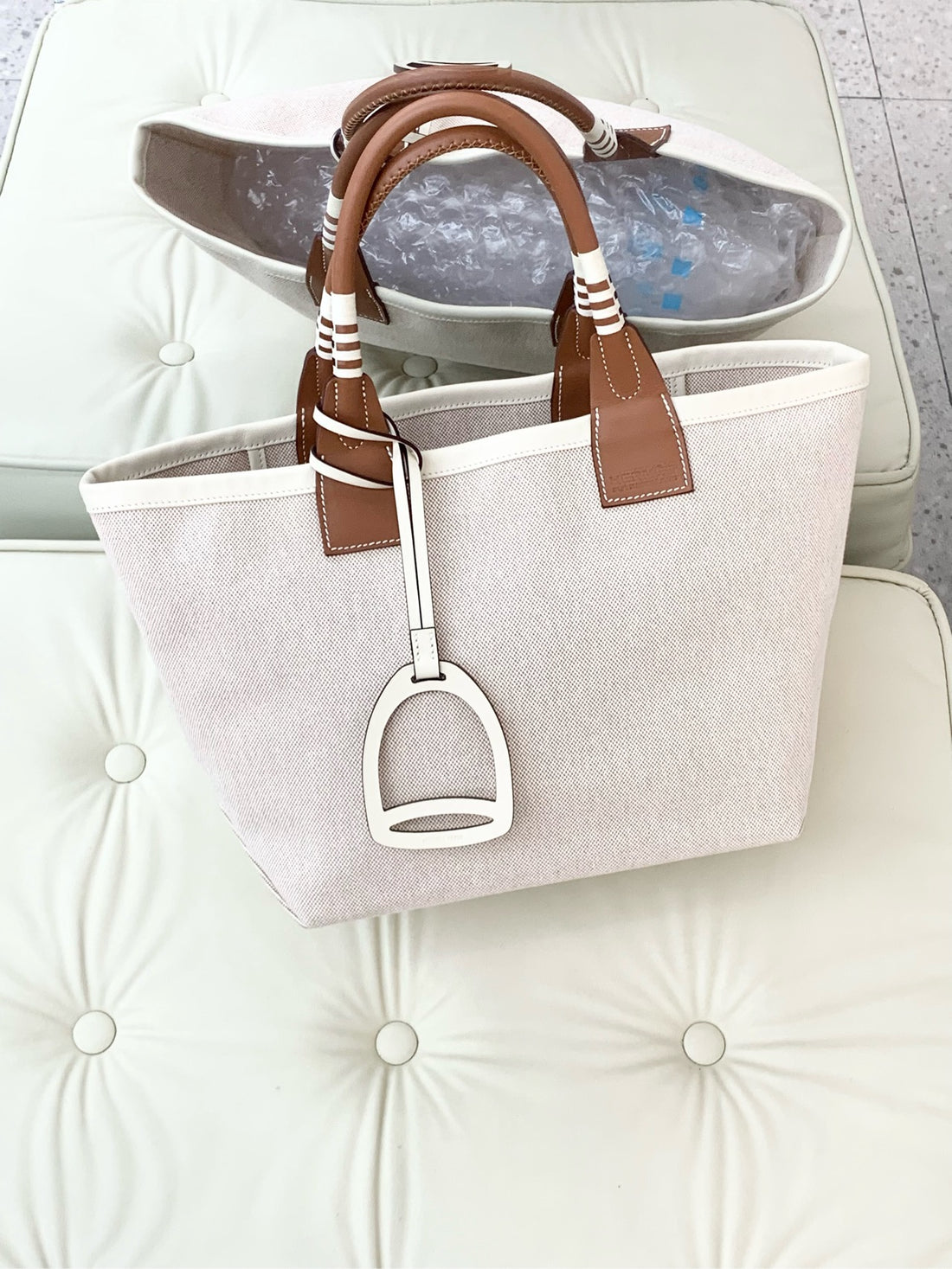 Hermès Steeple handbag, size 25, canvas H style/Swift leather, off-white/gold.